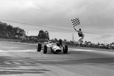Jim Clark, Lotus 43 BRM takes the chequered flag for victory.