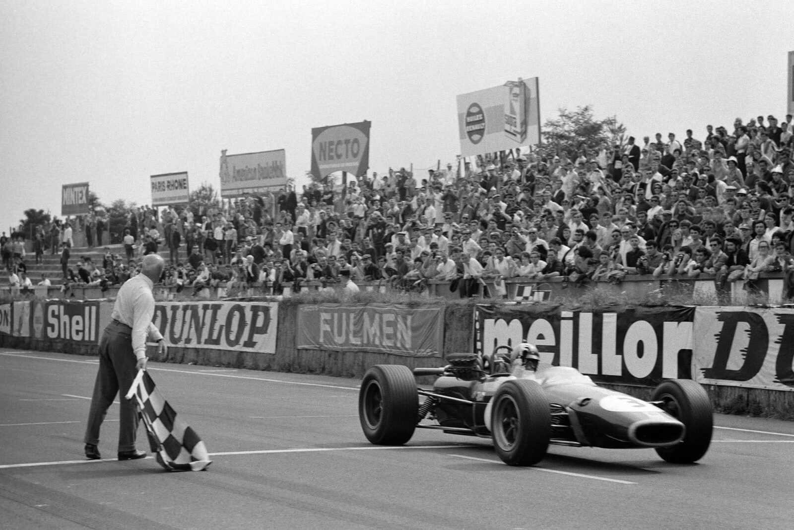Jack Brabham, Brabham BT24 Repco takes the chequered flag for victory.