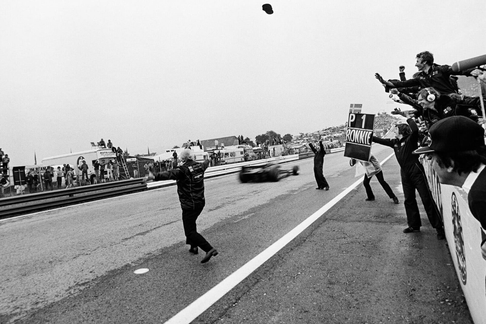 ROnnie Peterson (Lotus) passes the finish line to win the 1978 Austrian Grand Prix.