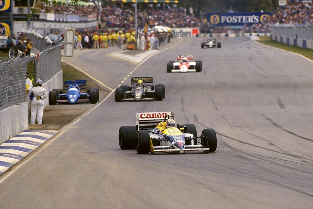 Nigel Mansell leads the pack in his Williams FW11 but did not finish.