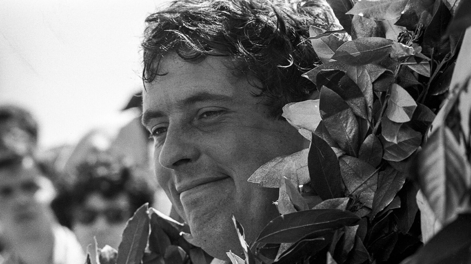 Brian Redman on the podium at the 1972 Spanish Grand Prix