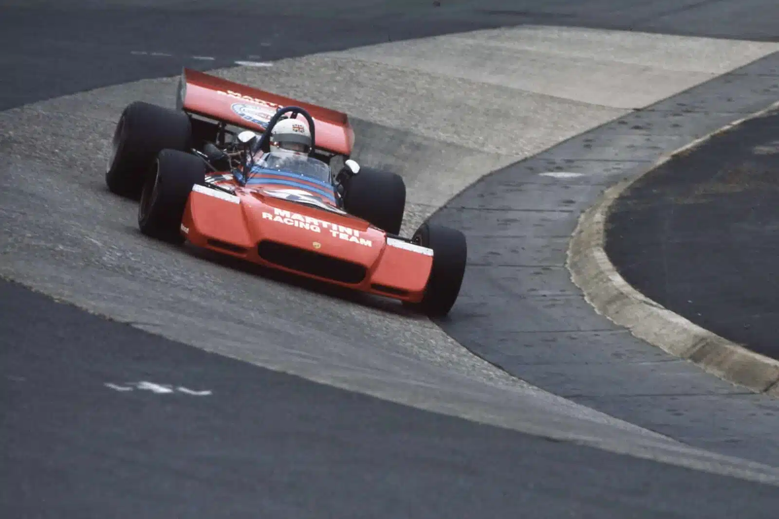 Derek Bell of Great Britain drives the #27 Martini Racing Team Tecno PA123 Tecno Flat-12 through the Karussell during the German Grand Prix on 30th July 1972 at the Nurburgring near Nurburg, Germany. (Photo by Grand Prix Photo/Getty Images)