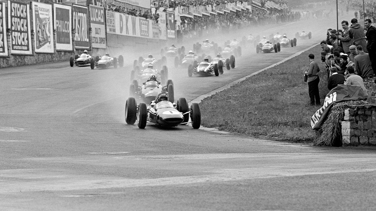 Lotus of Jim Clark leads at Eau Rouge on the first lap of the 1963 F1 Belgian Grand Prix