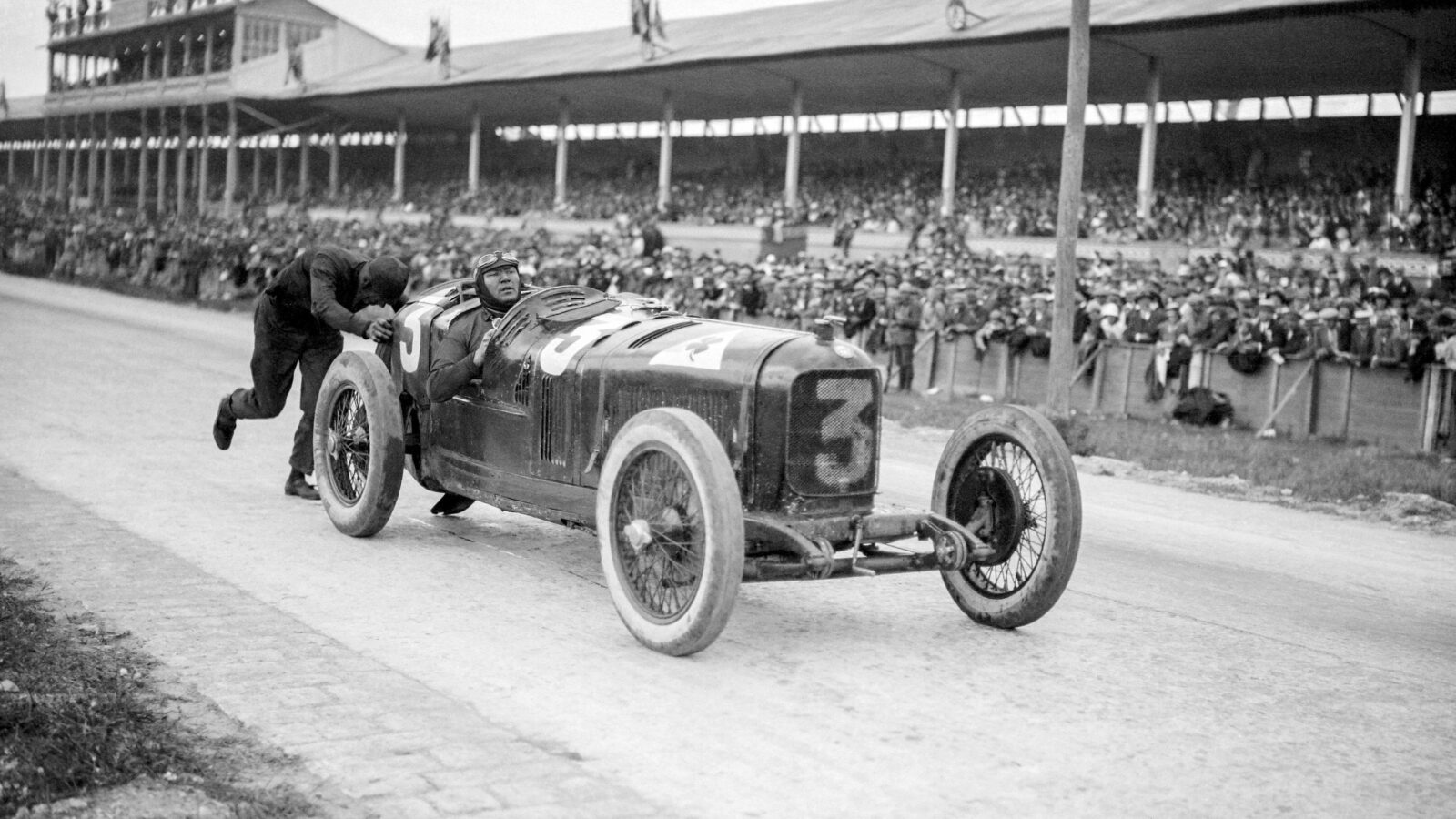 Mechanic pushes Alfa Romeo of Antonio Ascari in 1924 French Grand Prix