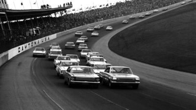 Pack-of-cars-racing-at-Daytona-500-in-1966