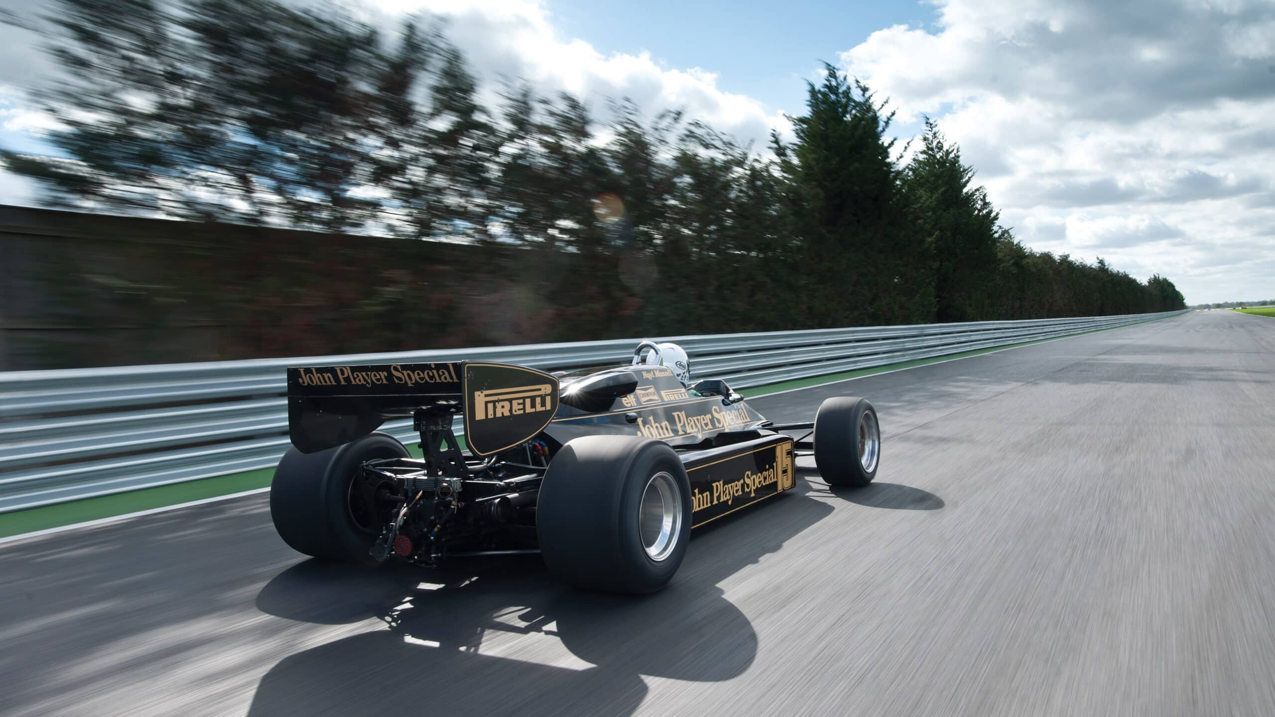 Rear view of Lotus 92 F1 car on track