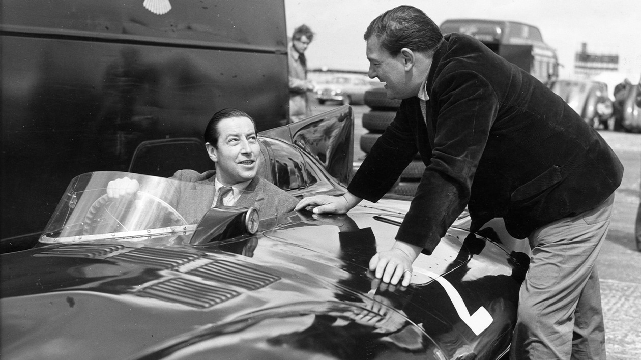 Tony Rolt in Jaguar D-type talks to Duncan Hamilton