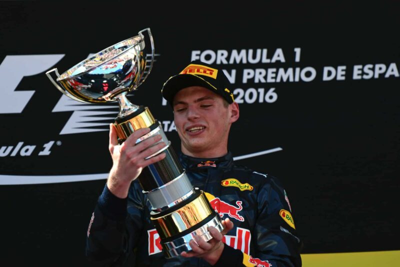 Max Verstappen holds the first-place trophy