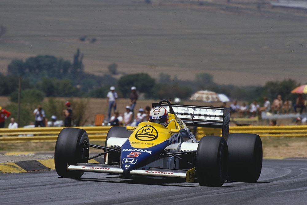 Nigel Mansell driving his Williams FW10 Honda in 1st position.