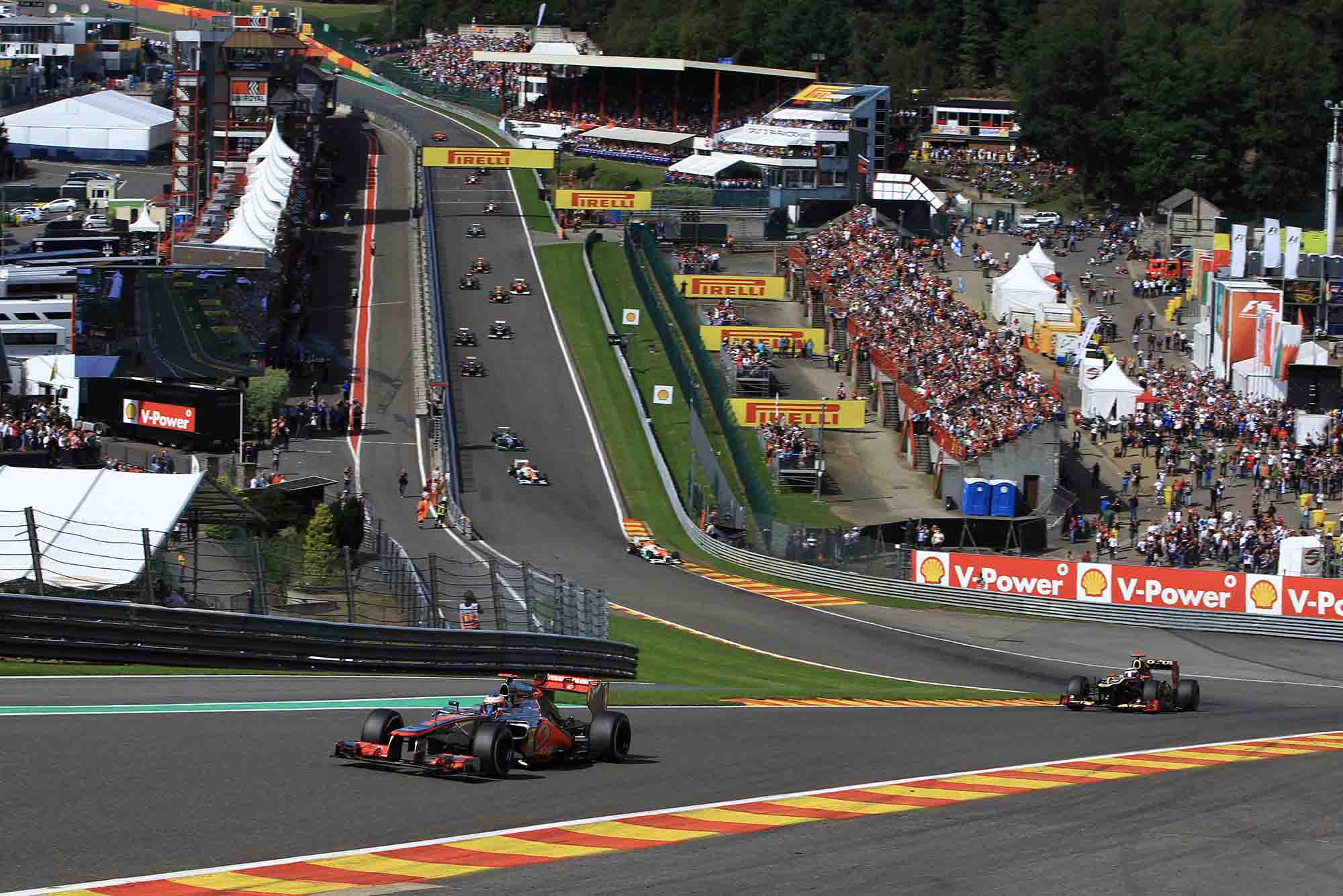 Jenson Button leads the field through Eau Rouge in his McLaren-Mercedes at 2012 Belgium Grand Prix Spa-Francorchamps