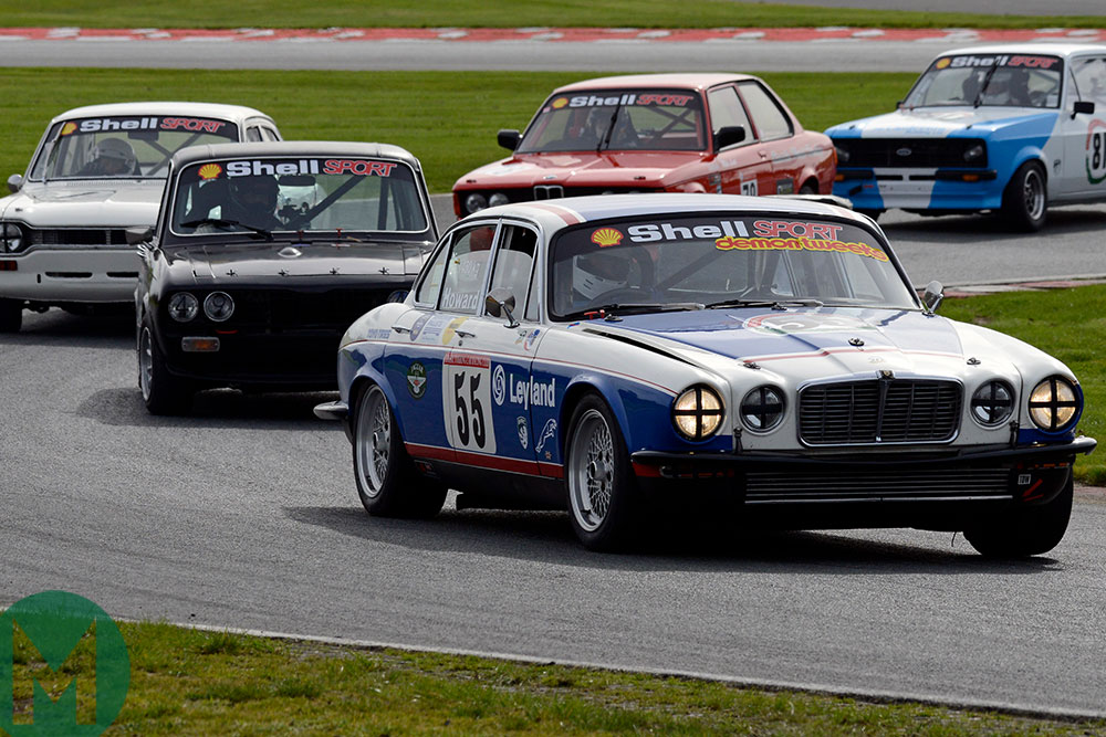 David Howard in his  Jaguar XJ12 seeks to hold off nimbler rivals at Oulton Park