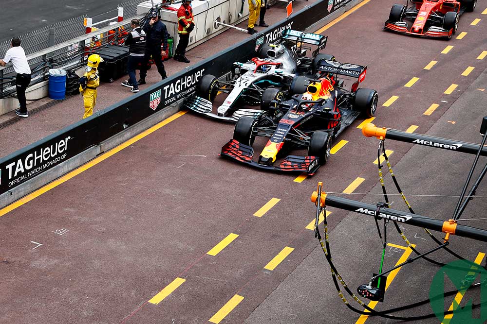 Max Verstappen and Valtteri Bottas side-by-side in the pit-lane