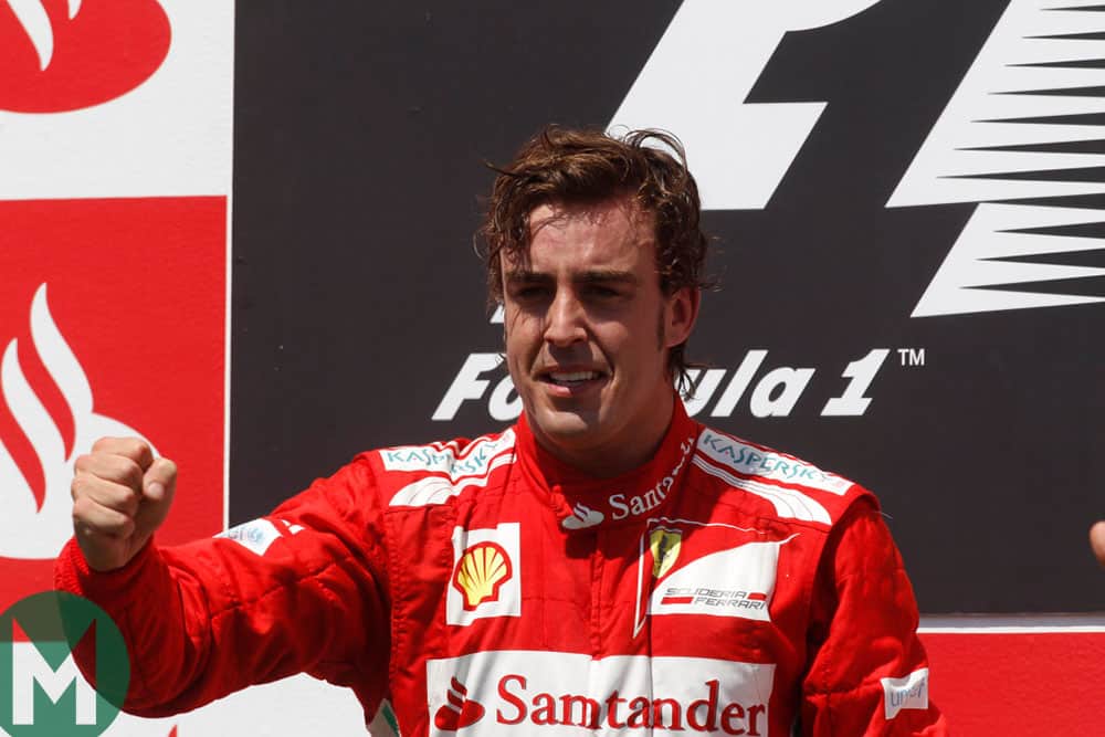 An emotional Alonso on the podium as he's cheered by his home fans