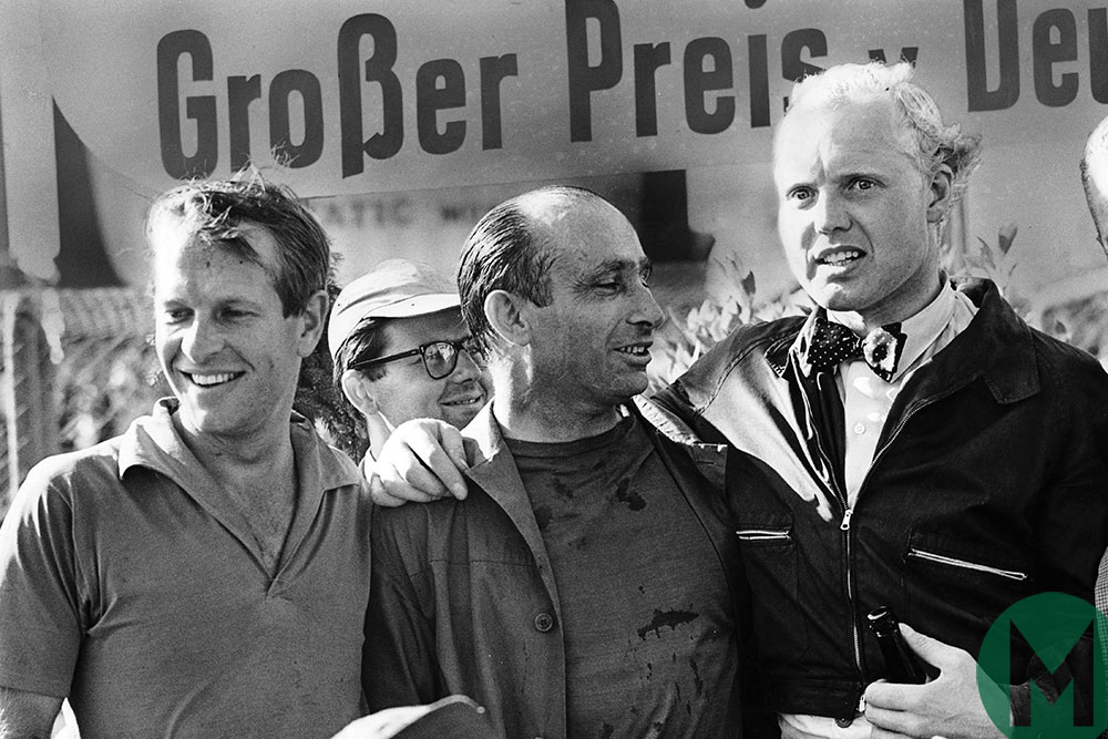 Hawthorn and Collins congratulate Fangio on the podium