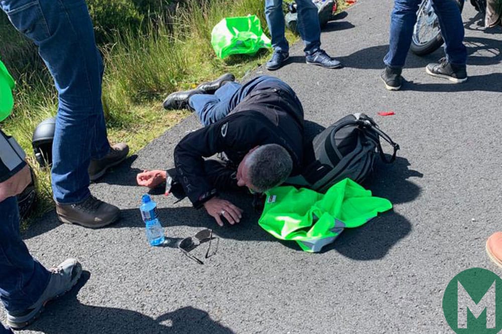 Donnelly lies on the ground after his motorbike accident