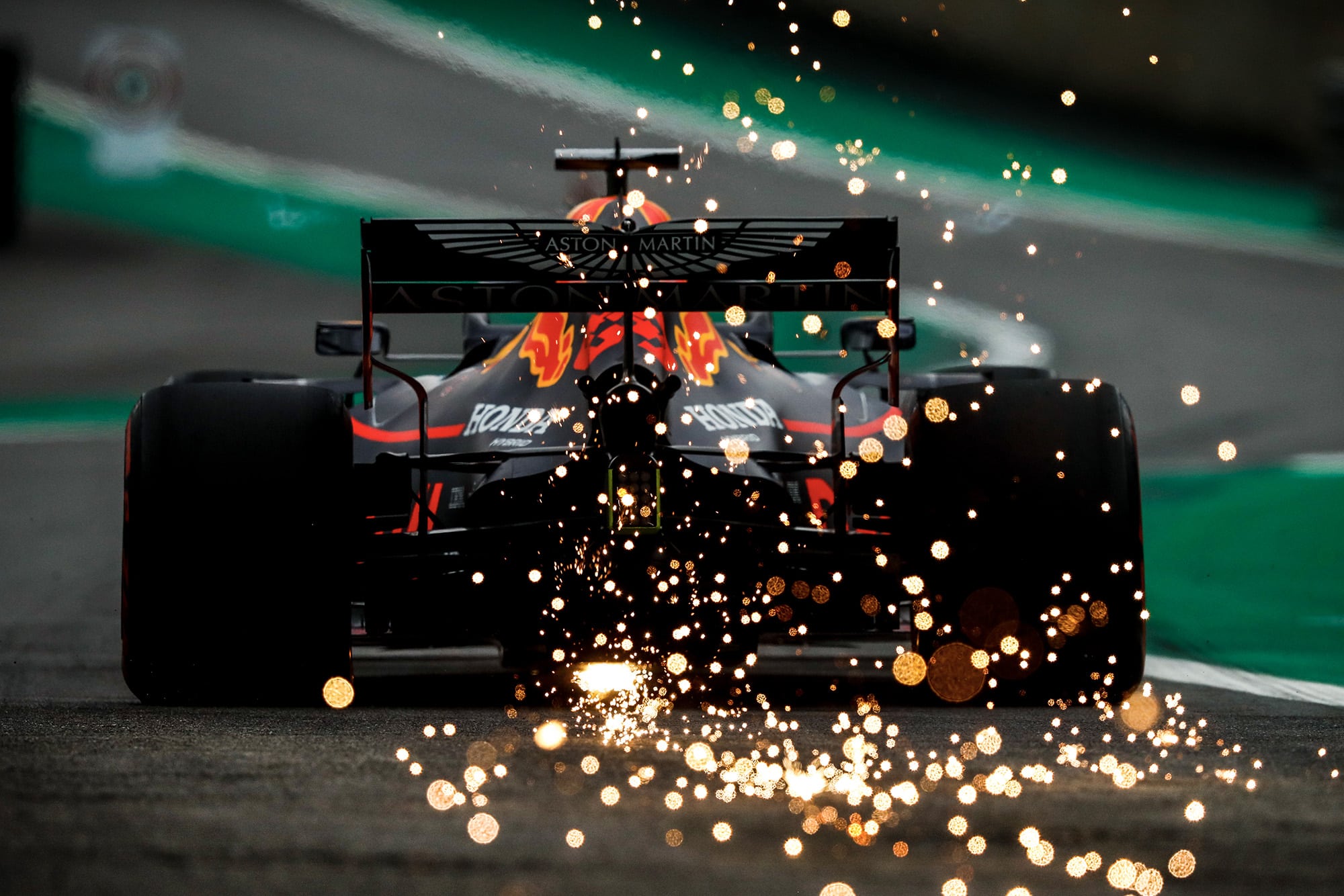 Sparks fly from the back of Max verstappen's Red Bull during qualifying for the 2019 Brazilian Grand Prix