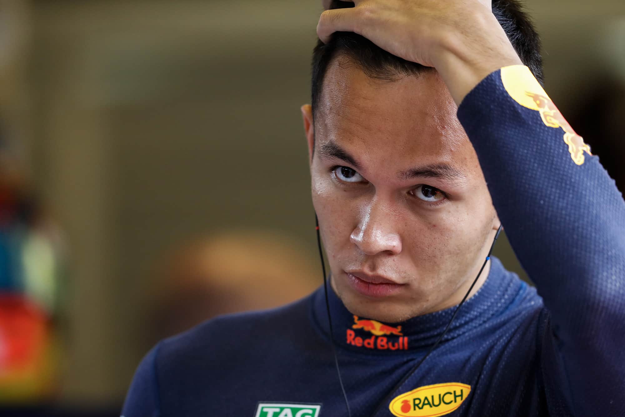 Alex Albon runs his hand through his hair during the 2019 Abu Dhabi Grand prix weekend