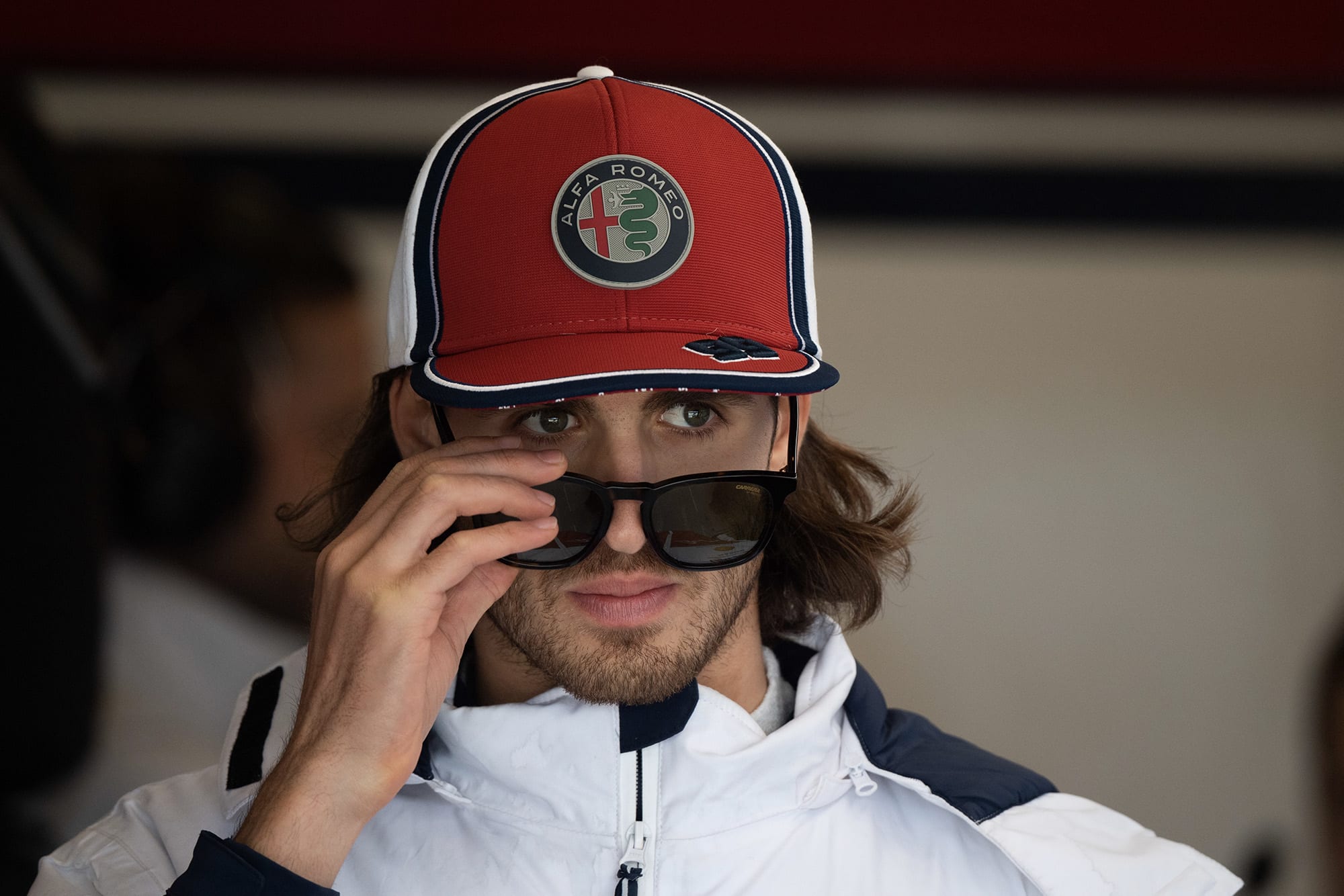 Antonio Giovinazzi lowers his sunglasses
