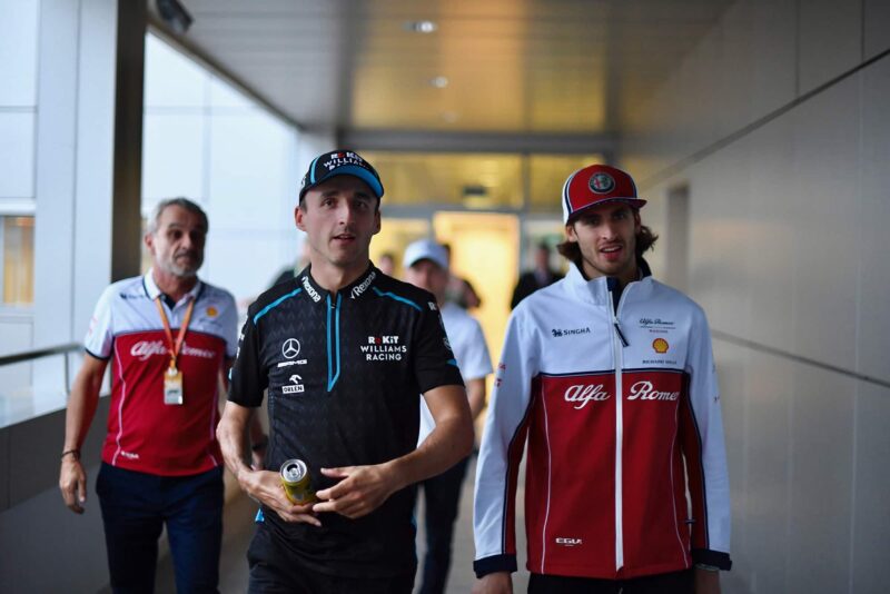 Wiliams' Robert Kubica walks ahead of ALfa Romeo's Antonio Giovinazzi