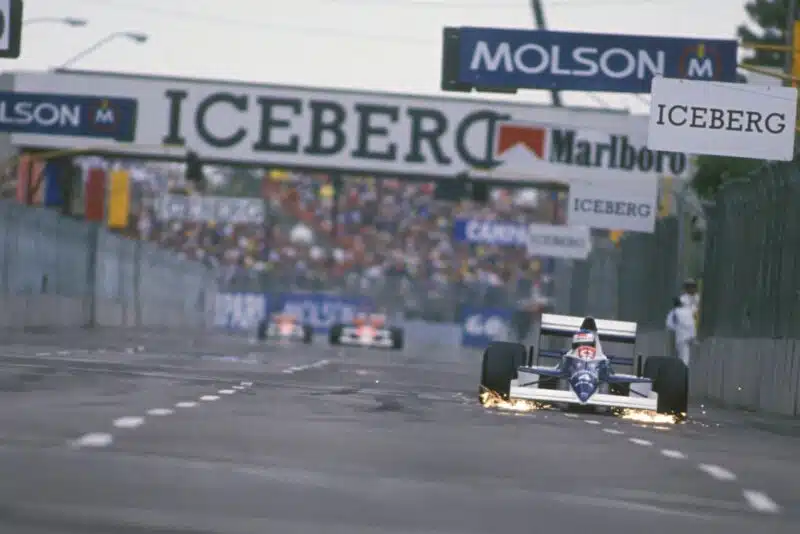 Jean Alesi's Tyrrell leads with a large gap to the chasing McLarens at the 1990 US Grand Prix