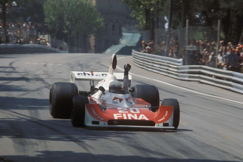Arturo Merzario raises his hand in protest over safety as he withdraws from the 1975 Spanish Grand Prix at Montjuich Park
