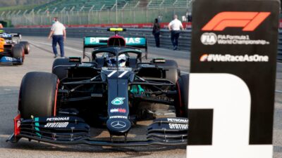 Valtteri Bottas parks his Mercedes in front of the. number 1 sign at imola after qualifying on pole for the 2020 F1 Emilia Romagna Grand Prix