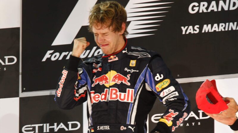 Sebastian Vettel cries as he stands on the top of the podium after the 2010 Abu Dhabi Grand Prix where he won his first F1 World Championship