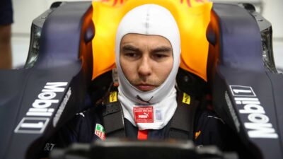 Sergio Perez sits in a Red Bull F1 car for the first time in January 2021
