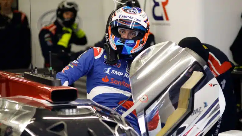 Jenson Button gets into his SMP Racing car at the 2018 Le Mans 24 Hours