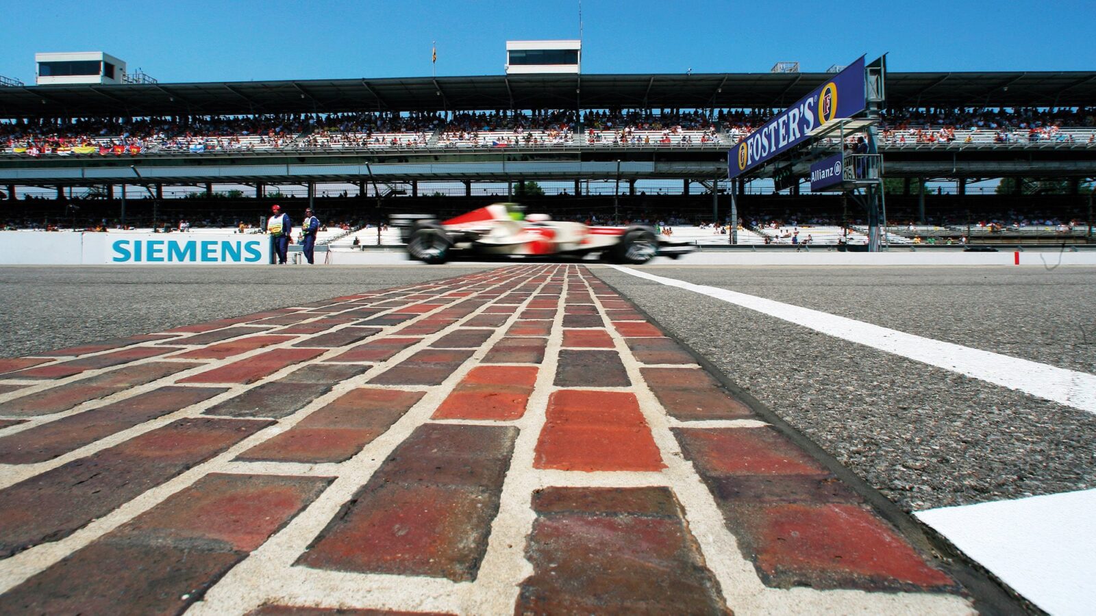 Jenson Button crosses the start finish line at the 2006 US Grand Prix
