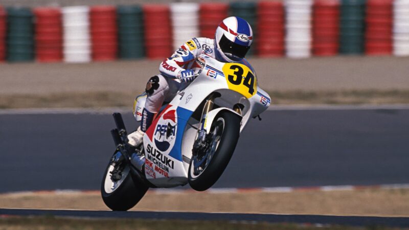 Kevin Schwantz lifts the front wheel of his Suzuki at Suzuka 1988