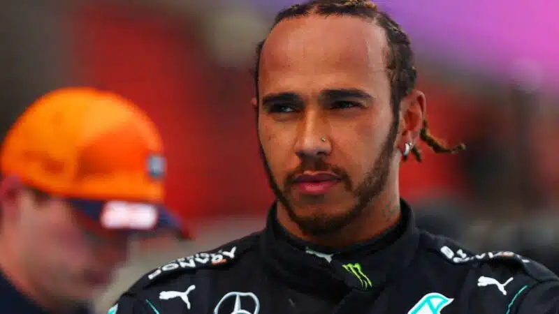 Lewis Hamilton with Max Verstappen in background