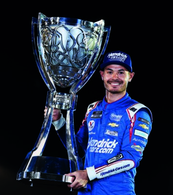 Kyle-Larson-with-NASCAR-Cup-Series-trophy
