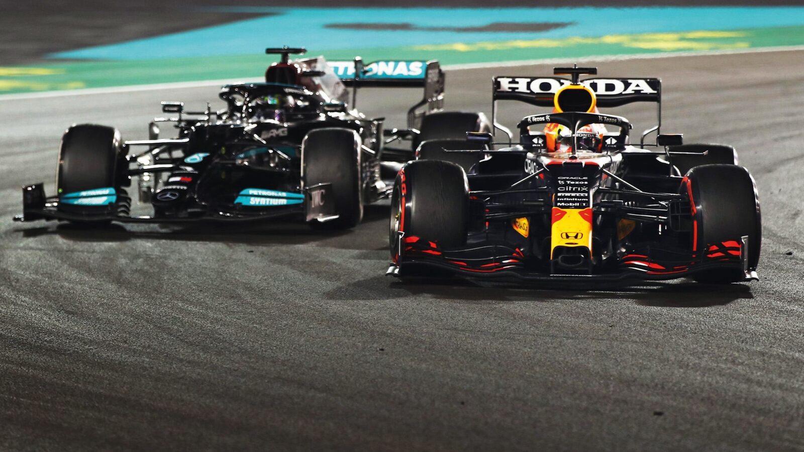 Max Verstappen passes Lewis Hamilton in the 2021 Abu Dhabi Grand Prix