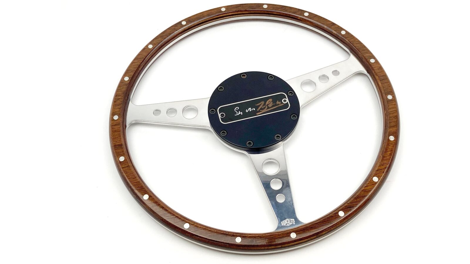 Signed Stirling Moss steering wheel