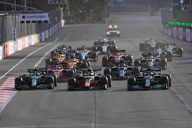 Sebastian Vettel (Aston Martin-Mercedes), Sergio Perez (Red Bull-Honda) and Lewis Hamilton (Mercedes) side by side after the re-start of the 2021 Azerbaijan Grand Prix in Baku.