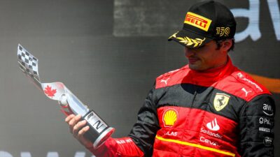 Carlos Sainz holds trophy on the 2022 Canadian GP podium