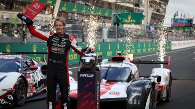 Fireworks go off as Brendon Hartley celebrates securing pole position for the 2022 Le Mans 24 Hours