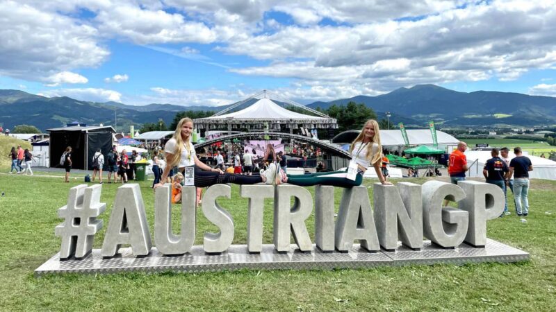 Desiree and Virginia Stubbe on an Austrian GP sign