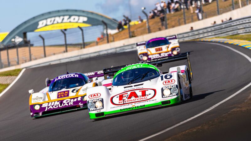 Group-C-cars-in-front-of-Dunlop-Bridge-in-the-2022-Le-Mans-Classic