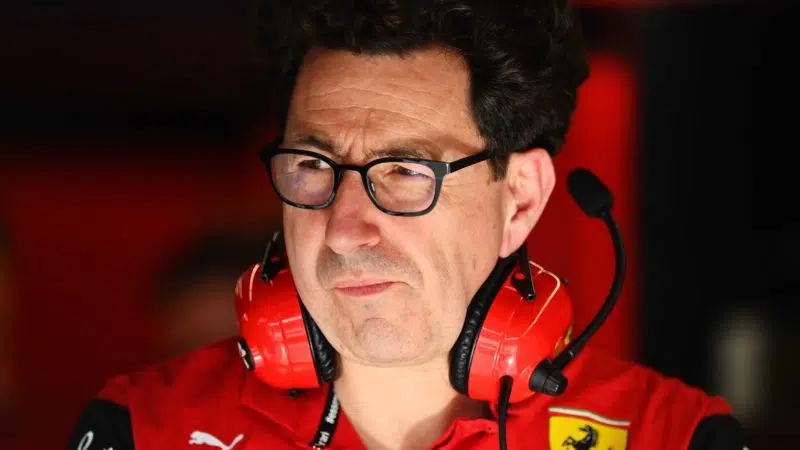 Mattia-Binotto-in-pit-garage-with-headphones-round-his-neck
