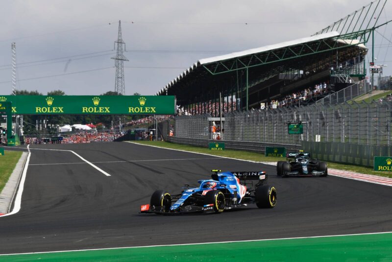 Esteban Ocon leads Sebastian Vettel in the 2021 Hungarian GP
