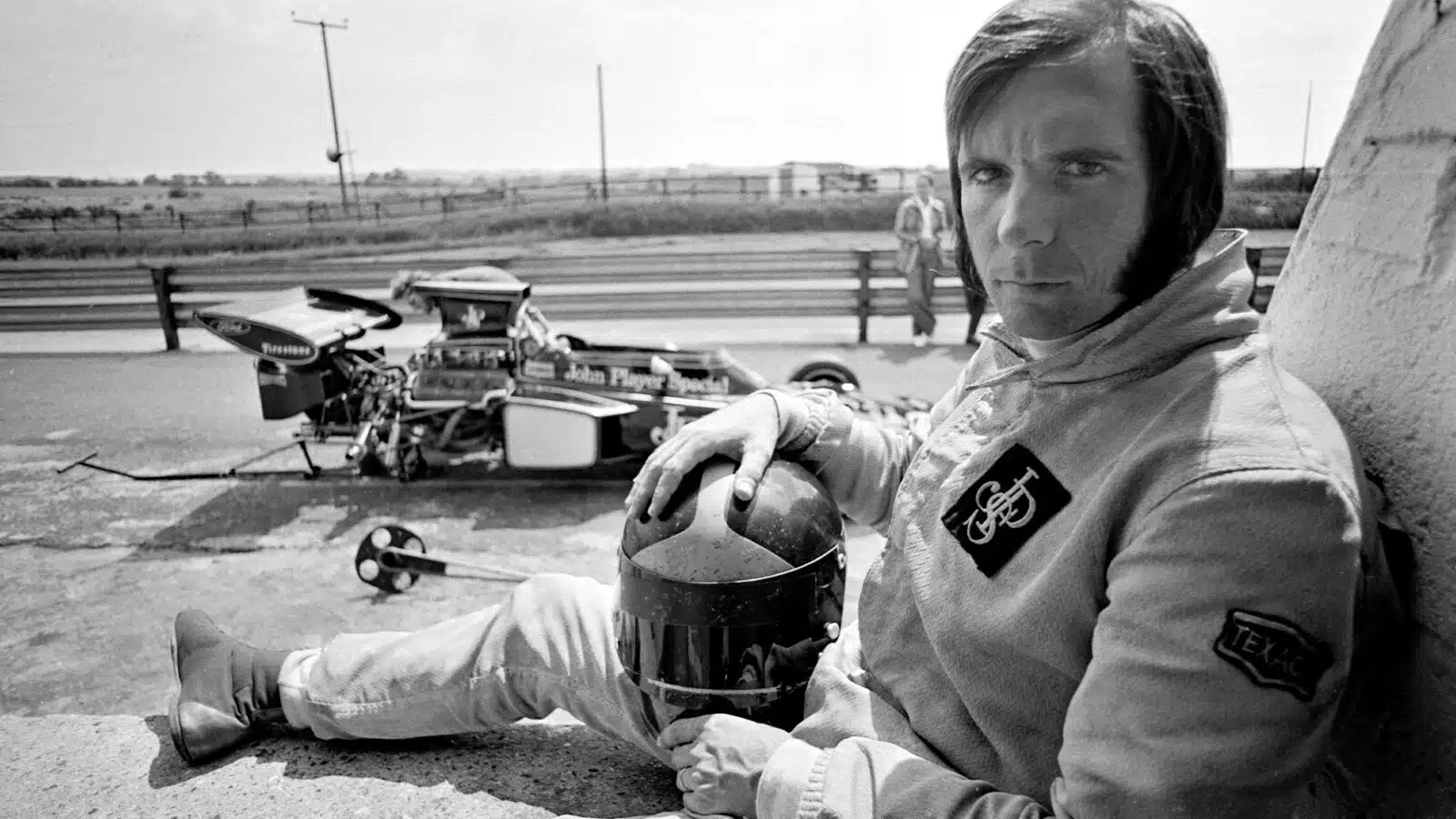 Emerson Fittipaldi sits in Zandvoort pits close to Lotus 72
