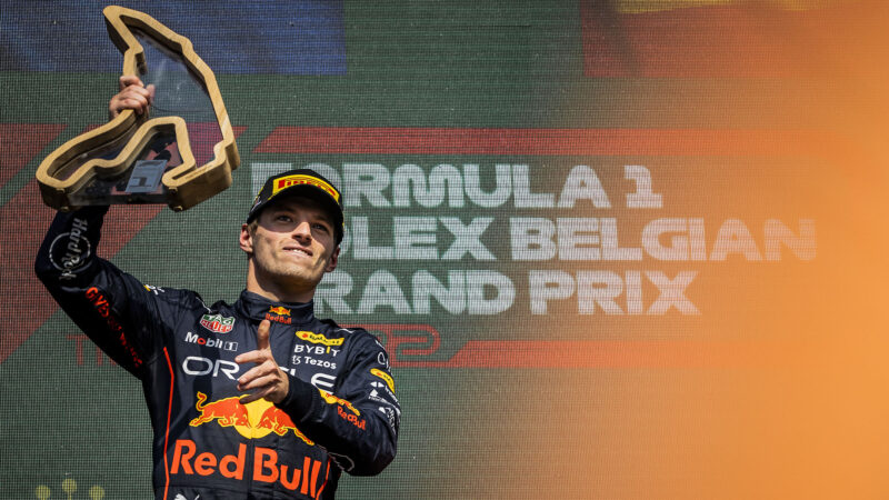 Max Verstappen raises his trophy after winning the 2022 Belgian Grand Prix