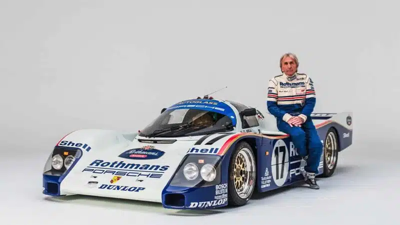 Porsche-Group-C-driver-Derek-Bell-sits-with-a-962