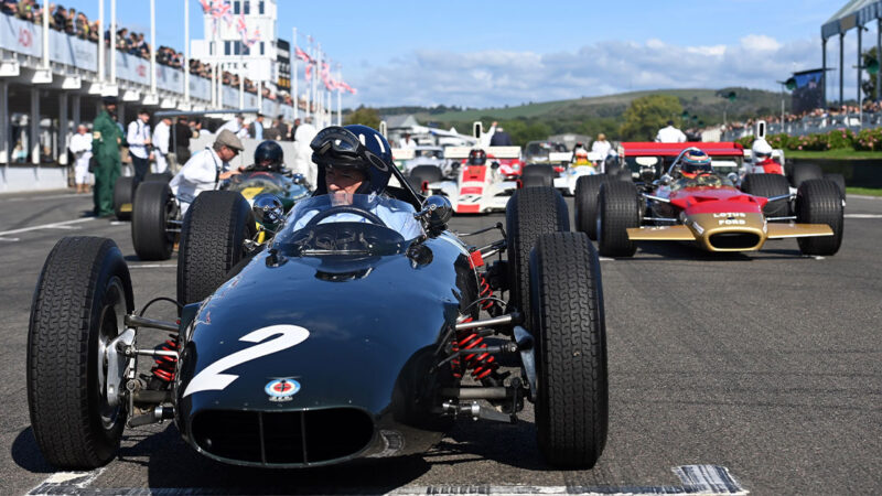 Damon Hill gets ready to set off on the parade to celebrate the 60th anniversary of his father Graham's first F1 title