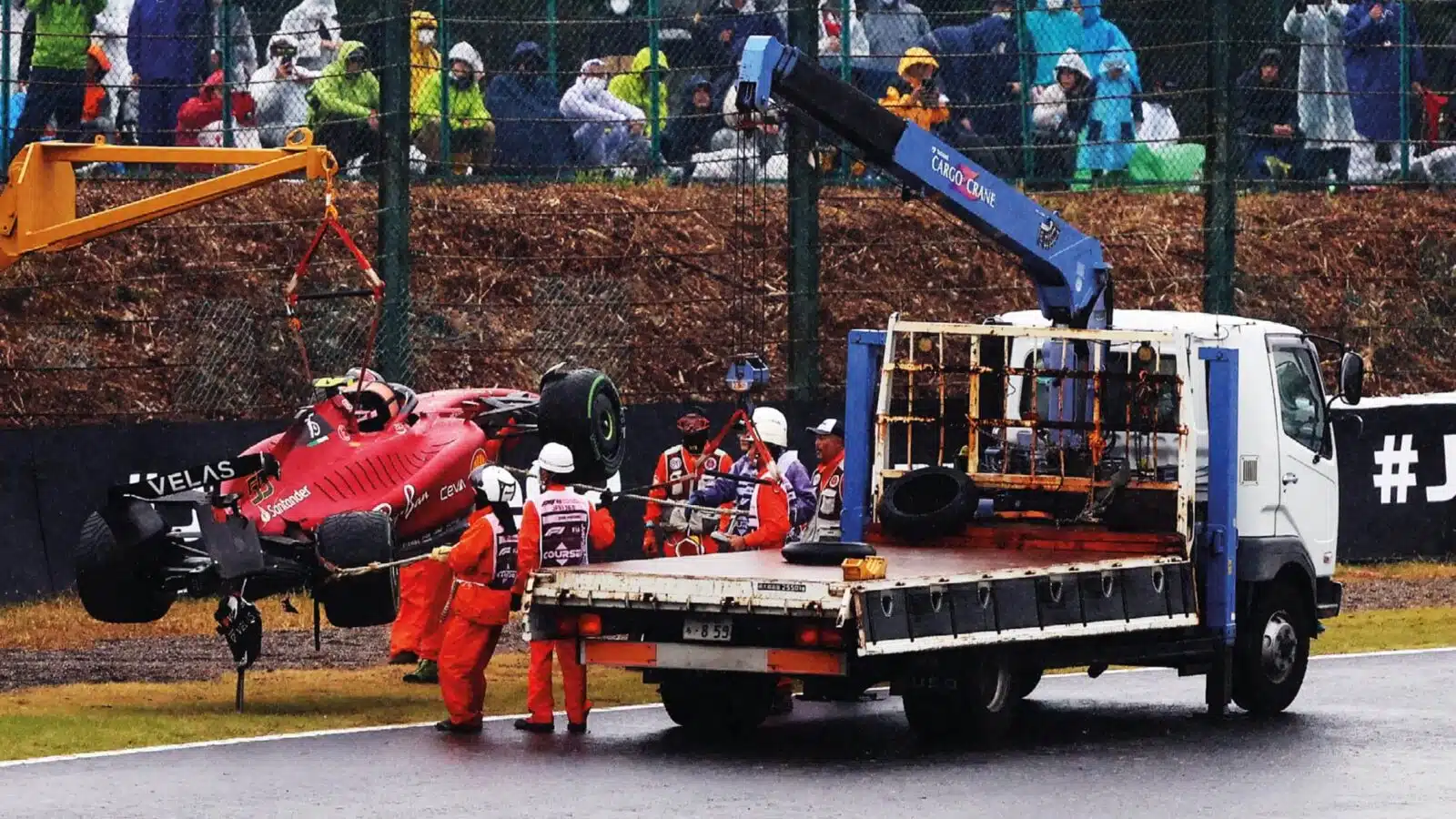Crane lifting an F1 car