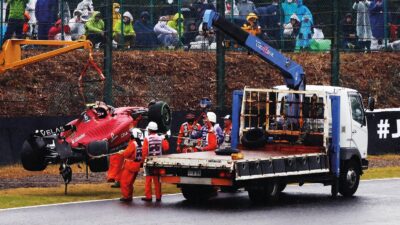Crane lifting an F1 car