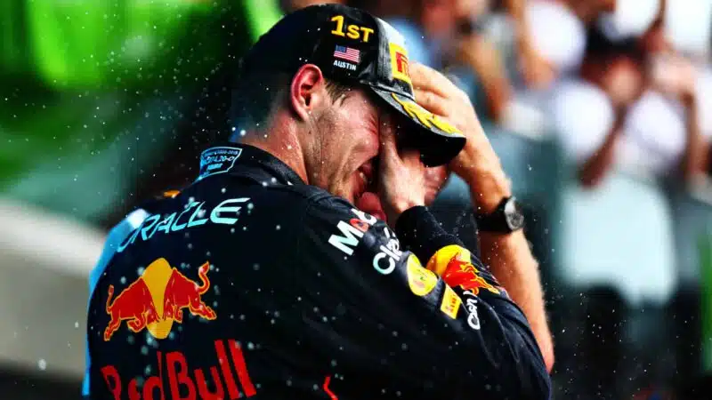 Max Verstappen holds his face after winning the 2022 US GP and constructors championship