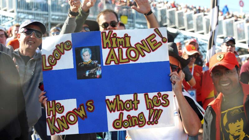 F1 fans hold up a Kimi Raikkonen leave me alone I know what Im doing flag